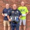 The Fairfax Police Department recently received some new donated equipment. Pictured are (front row) Officer Denny Adamski, holding the new PBT (Breathalyzer), and (back row) Officer Karl Koford and Chief of Police Scott Froehlich, both holding the new Vehicle First Aid Kids that the department received. (Submitted photo)