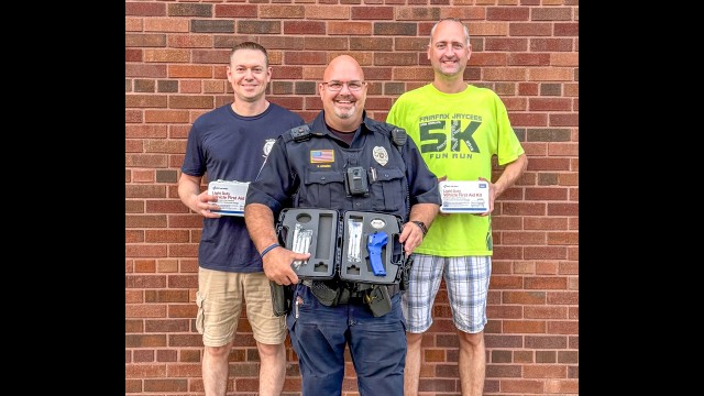 The Fairfax Police Department recently received some new donated equipment. Pictured are (front row) Officer Denny Adamski, holding the new PBT (Breathalyzer), and (back row) Officer Karl Koford and Chief of Police Scott Froehlich, both holding the new Vehicle First Aid Kids that the department received. (Submitted photo)