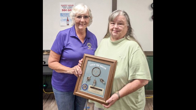 Pictured presenting the award to Joyce Woods is Gibbon Lions President, Sue Bentz. (Submitted photo)